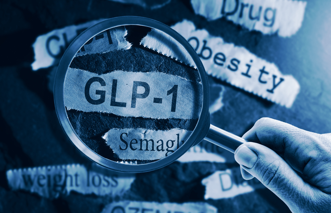 magnifying glass over weight-loss drug headlines