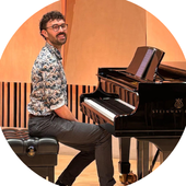 Man sits at black piano