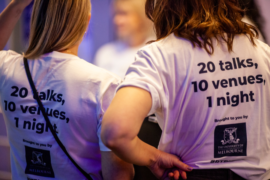 People wearing tshirts with writing on them. 