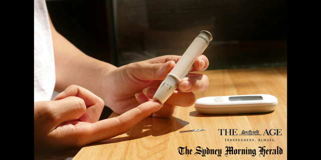 person uses finger prick to test for blood sugar levels
