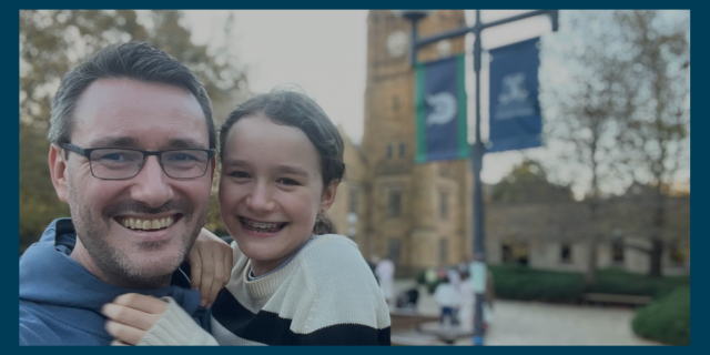 Father and daughter at Parkville Campus clock tower