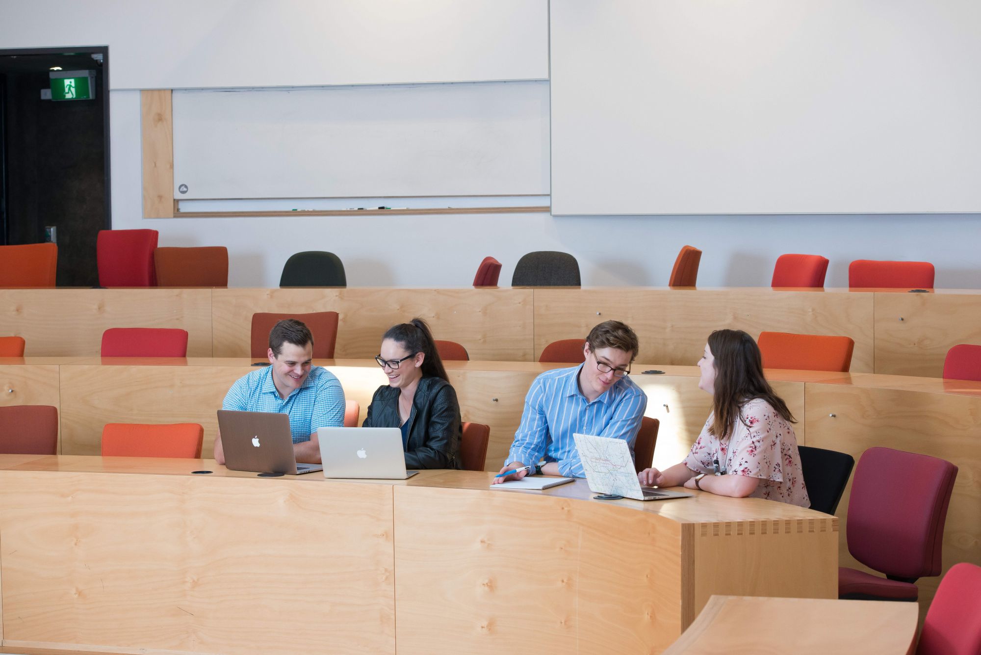 A group of students studying in a seminar room