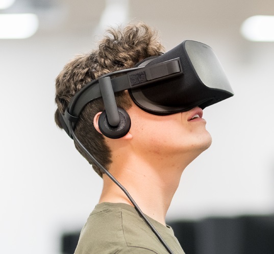 A student wearing an Oculus Rift headset