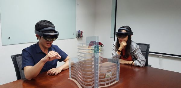 Two students using a Microsoft Hololens